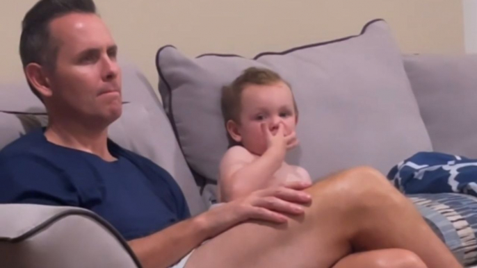 Dad, meet booger: Naughty baby boy puts booger on dad's face