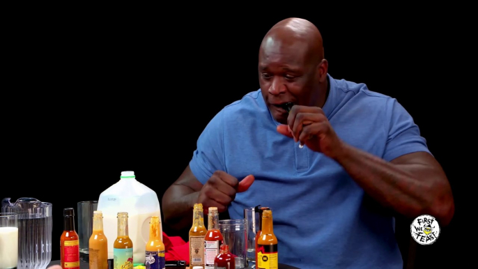 Shaq Tries to Not Make a Face While Eating Spicy Wings | Hot Ones | First We Feast