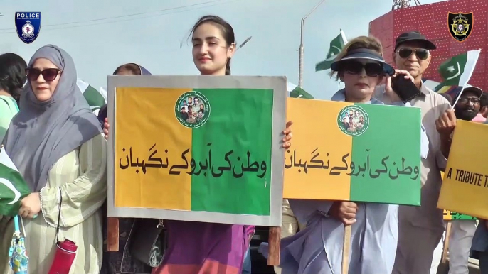 A WALK HELD IN CONNECTION WITH YOUM-E-TAKREEM SHUHADA-E-PAKISTAN AT SEA VIEW; DIG SECURITY DR.MAQSOOD AHMED PARTICIPATED