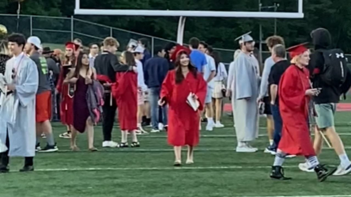 Graduating woman hit with a tank of emotions after her Marine sister appears out of nowhere