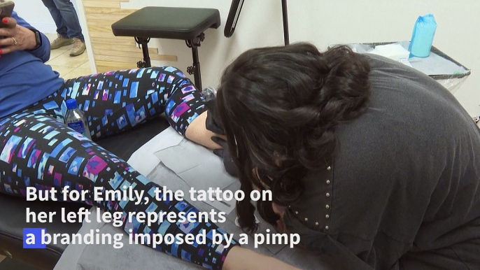 Tattoos cover up painful pasts for US sex-trafficking victims