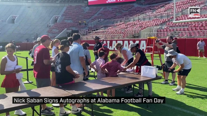 Nick Saban Signs Autographs at Alabama Football Fan Day