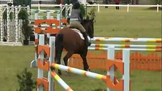 Paige Burton jumping out of the ring