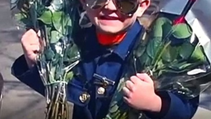 Child 'Police Officer' Spreads Love At Nursing Homes With Hugs & Flowers