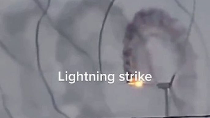 Electrifying Moment: Lightning Strikes Windmill in Spectacular Display!