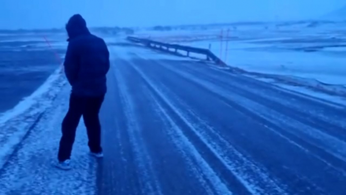 Andøya, Norway: CRAZY winds of storm drag fully-grown man across icy ground