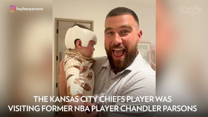 Travis Kelce Adorably Cheeses with His Friend Chandler Parsons' Baby — and Signs Boy's Cranial Helmet!