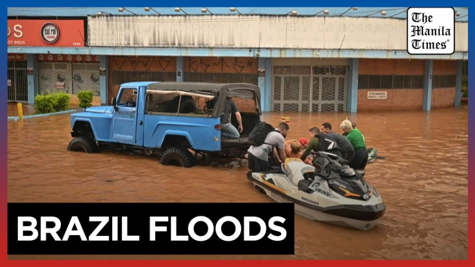 Brazilian volunteers rush to rescue people stranded by deadly floods