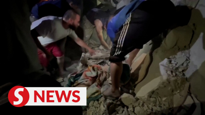 Gazans pull children casualties from under the rubble after overnight strike