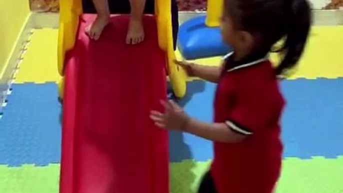 Adorable Kids Having Unlimited Fun on Slides and Toys