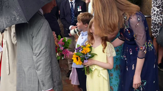 King and Queen brave torrential rain to enjoy Jersey parade