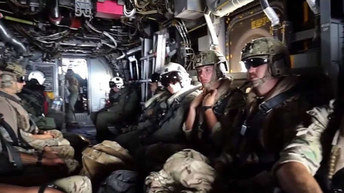 Brave Soldiers Descend from Sky onto Aircraft Carrier amidst Endless Ocean