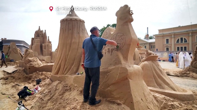 Artists craft sand masterpieces despite rain at the St Petersburg Sand Sculpture Festival