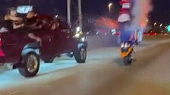 Dude pops a wheelie with firework cannons