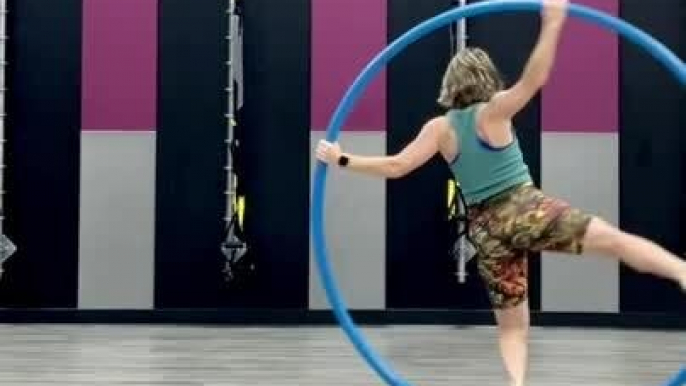 Woman Spins on Cyr Wheel