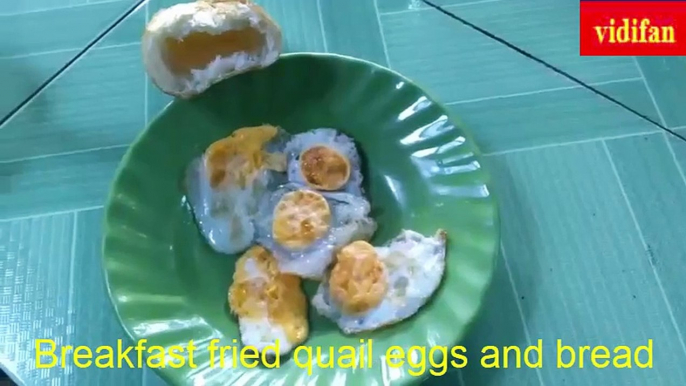 breakfast with fried quail eggs and bread