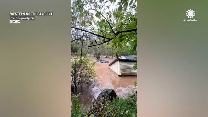 Helene's flooding carries away vehicles and structures in North Carolina