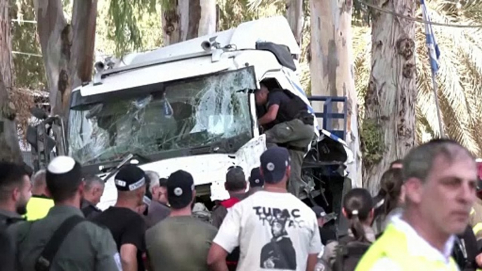 One dead, dozens injured in truck ramming at Israeli bus stop