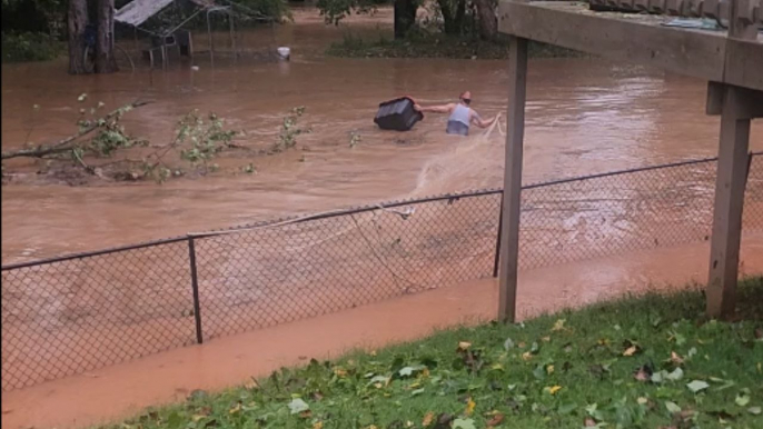 Man bravely navigates dangerous floodwaters to save chickens during Hurricane Helene