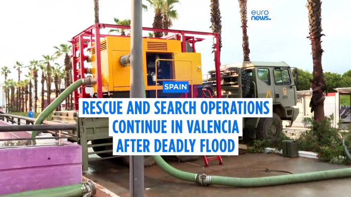 Troops search for more flood victims in Valencia as rain disrupts rail service