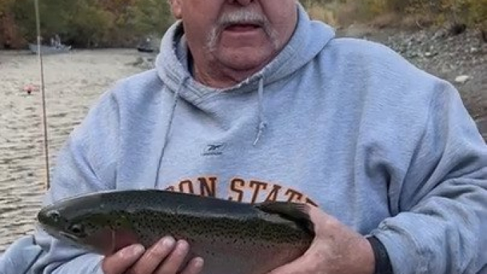 Fish Slips Away Into River During Catch