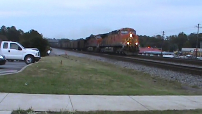 BNSF power leads NS 734 coal train NB through Austell Ga.