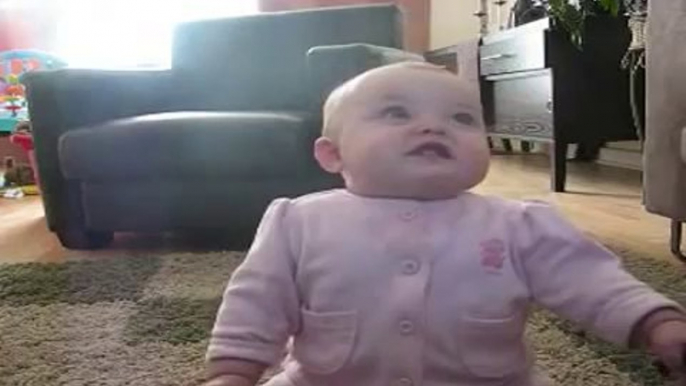 Baby laughing so cute while feeding my dog with popcorn