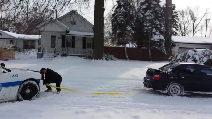 Subaru WRX Pulls Stuck Police Car Out Of Snow