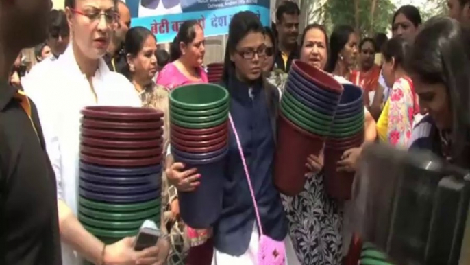 Rakhi Sawant distributes dustbins