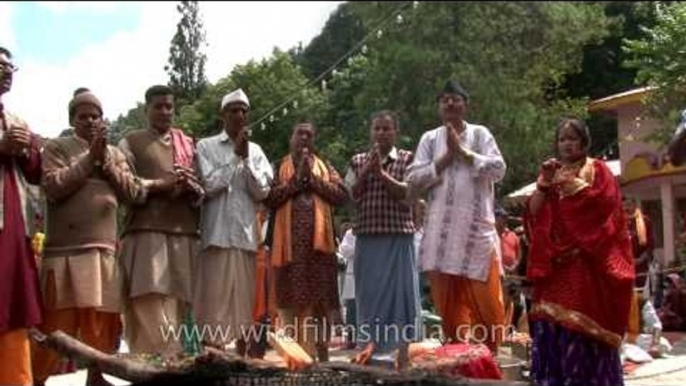 Devotees offering prayer after havan rituals