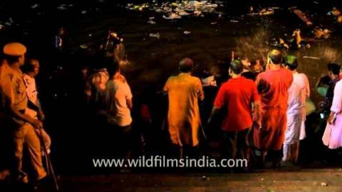 Deep in Ganga: Immersion of Durga idol in Ganga; Kolkata Durga puja