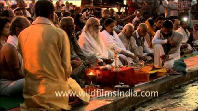 Hindu devotees performing puja during Maha Kumbh at Allahbad