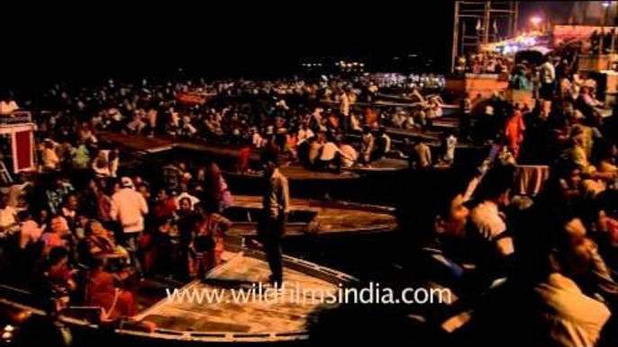 Devotees listening to devotional song on Varanasi ghat