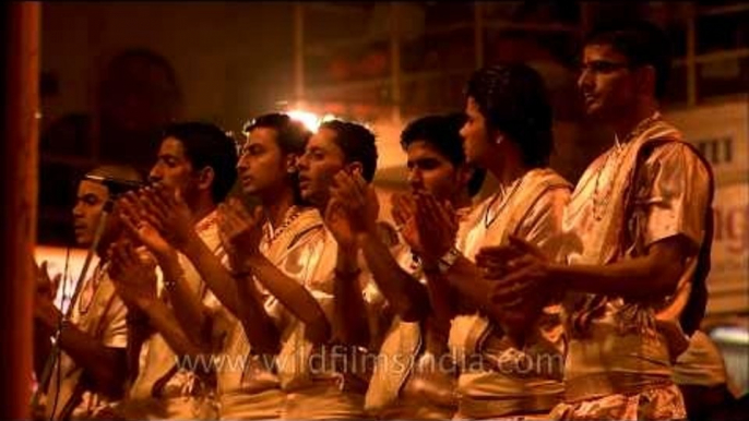 Priests singing devotional song at the Ghat of Varanasi