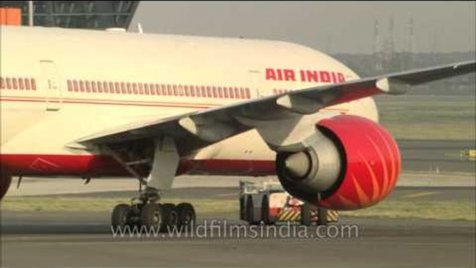 Air India Boeing plane is towed off runway, Delhi airport