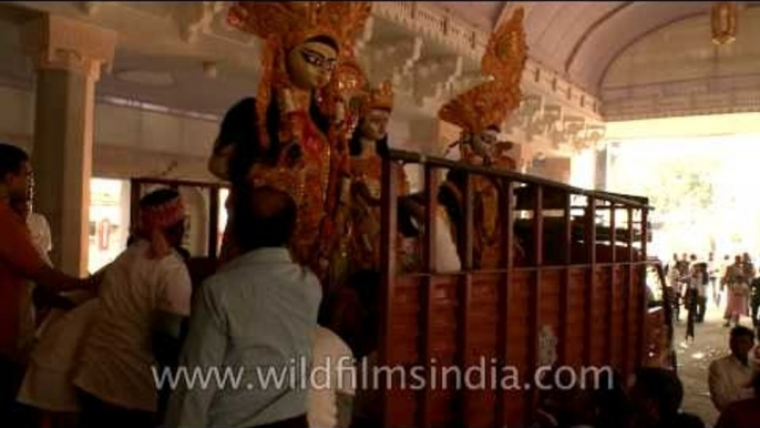 Idols of Goddess Durga being loaded in truck for immersion