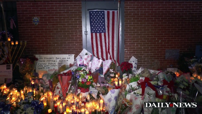 Melissa Mark Viverito visits memorial for slain NYPD cops