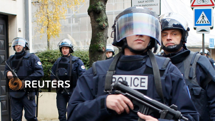 Paris police tackle twin hostage crises