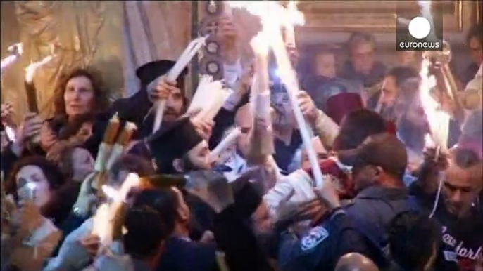 Thousands gather at the Holy Sepulchre in Jerusalem for the start of Orthodox Easter