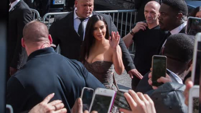 Kim Kardashian Showcases Her Cleavage For Kardashian Hair Paris Launch