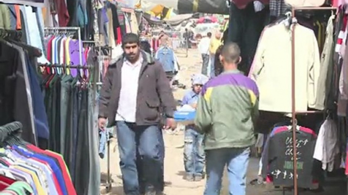 Arabic-Web-Strapped Gazans buy Israeli cast-off clothes