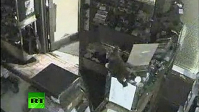 CCTV: Bear opens door to candy store, sneaks in for sugar fix