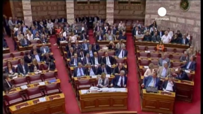 Protesters vent their anger as Greek parliament approves...