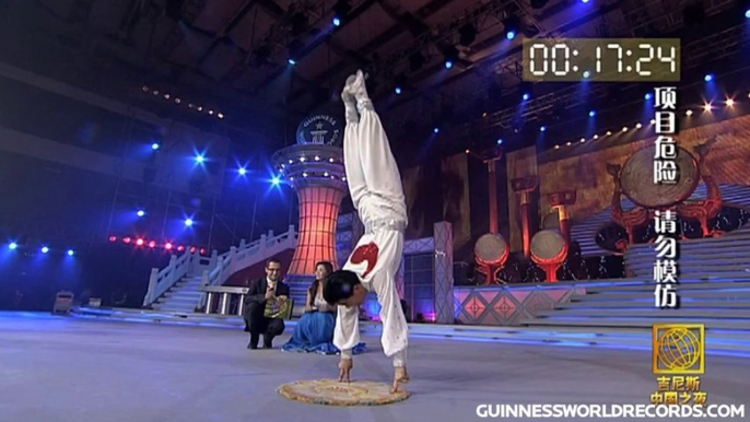 Longest duration balancing on four fingers - Guinness World Records Classics