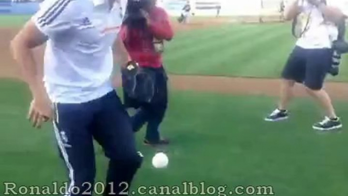 Cristiano Ronaldo juggles with a ball of baseball