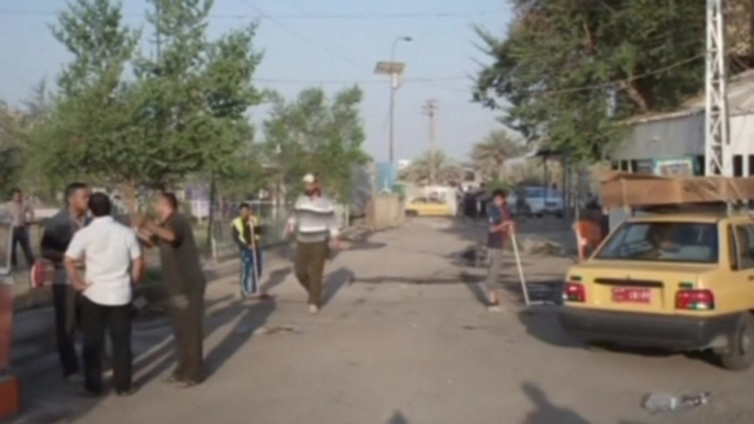 Iraqis clear streets after Baghdad cafe suicide bomber kills 25