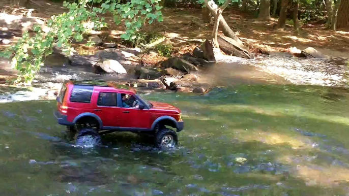 RC 1:10 Scale 4x4. Axial SCX-10 with Land Rover LR3 body. Some Rock Climbing and River Crawling.