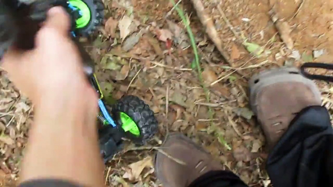 Maisto Tech RC Rockcrawler crawling up mud dunes