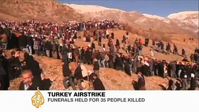 Angry Kurds bury victims of Turkish attack