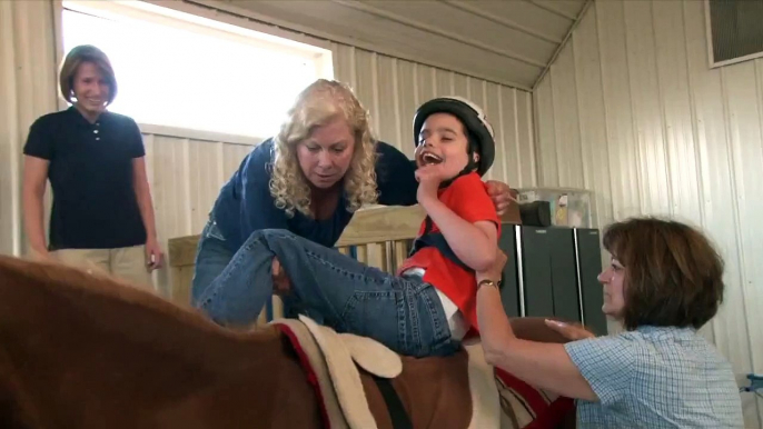 Horses help boy with cerebral palsy improve his walk